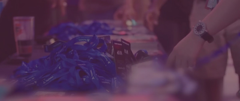 image of a table with VIP badges on it where people can pick them up. 