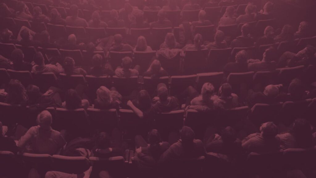 Stylized image of movie theater guests in their seats